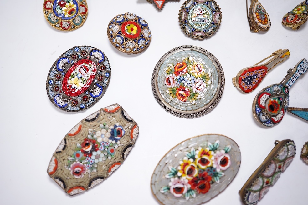 A collection of thirty-one micro-mosaic brooches, including fourteen mixed guitar and banjo shaped brooches, six large oval brooches and seven smaller brooches, three long brooches and a star shaped brooch. Condition - g